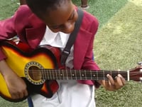 My College student  playing the guitar