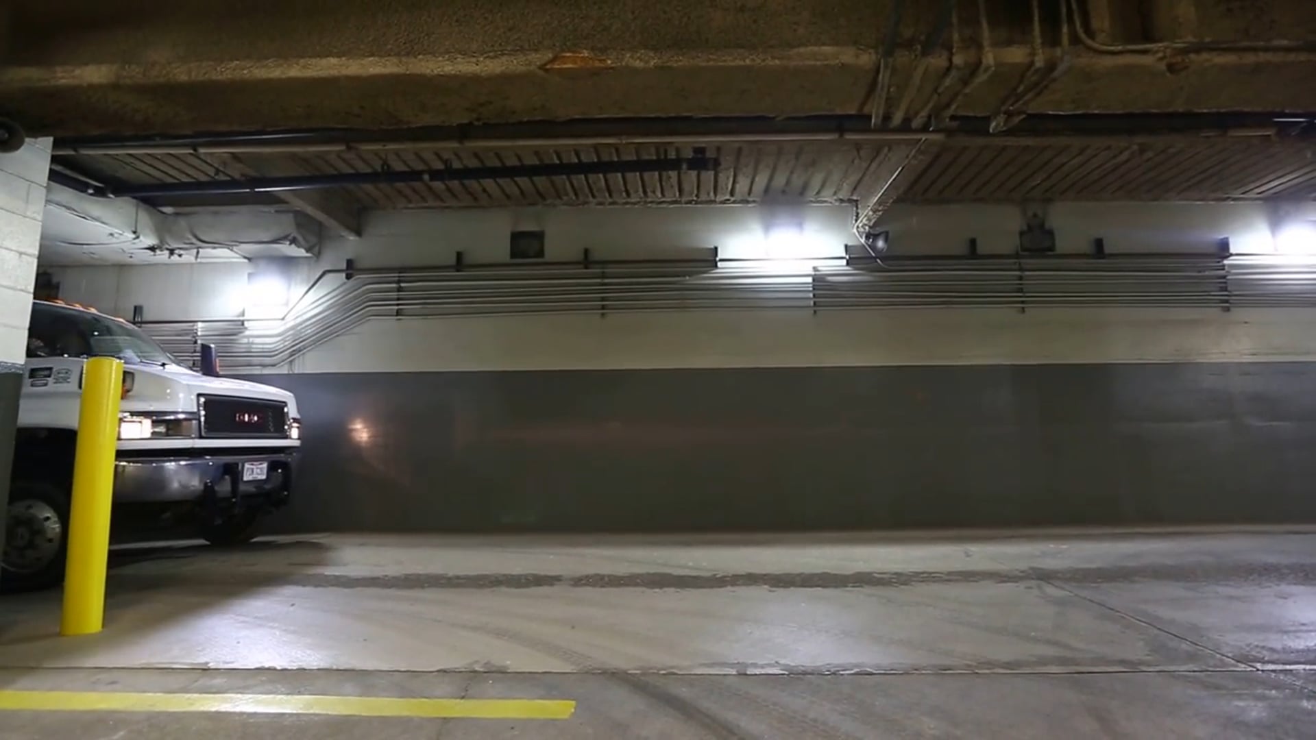 14' Qube Trailer compactor in a basement