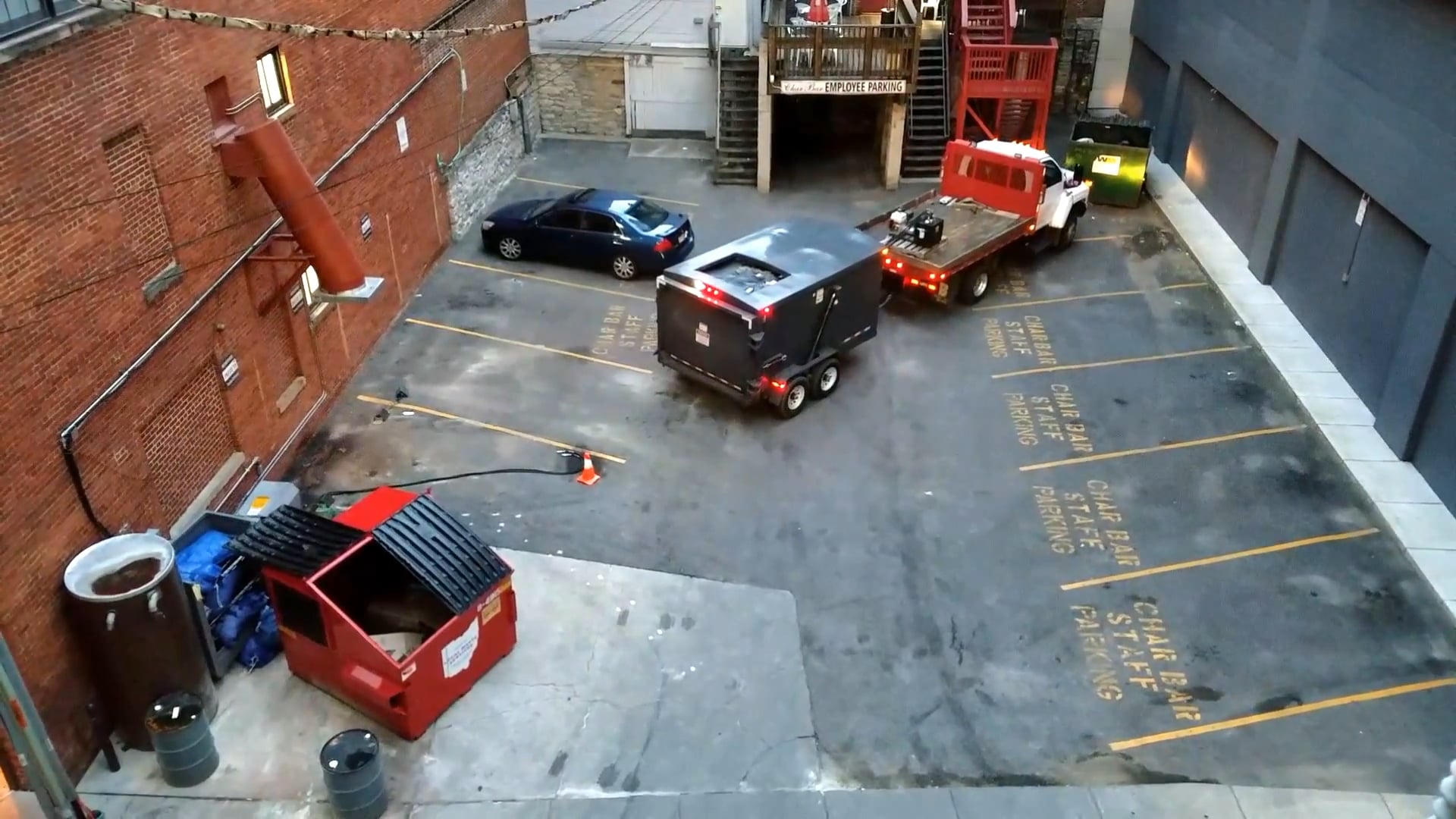 Qube Trailer compactor servicing a Chute in an alley