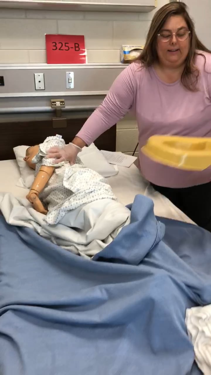 Giving a bedpan to a resident on Vimeo