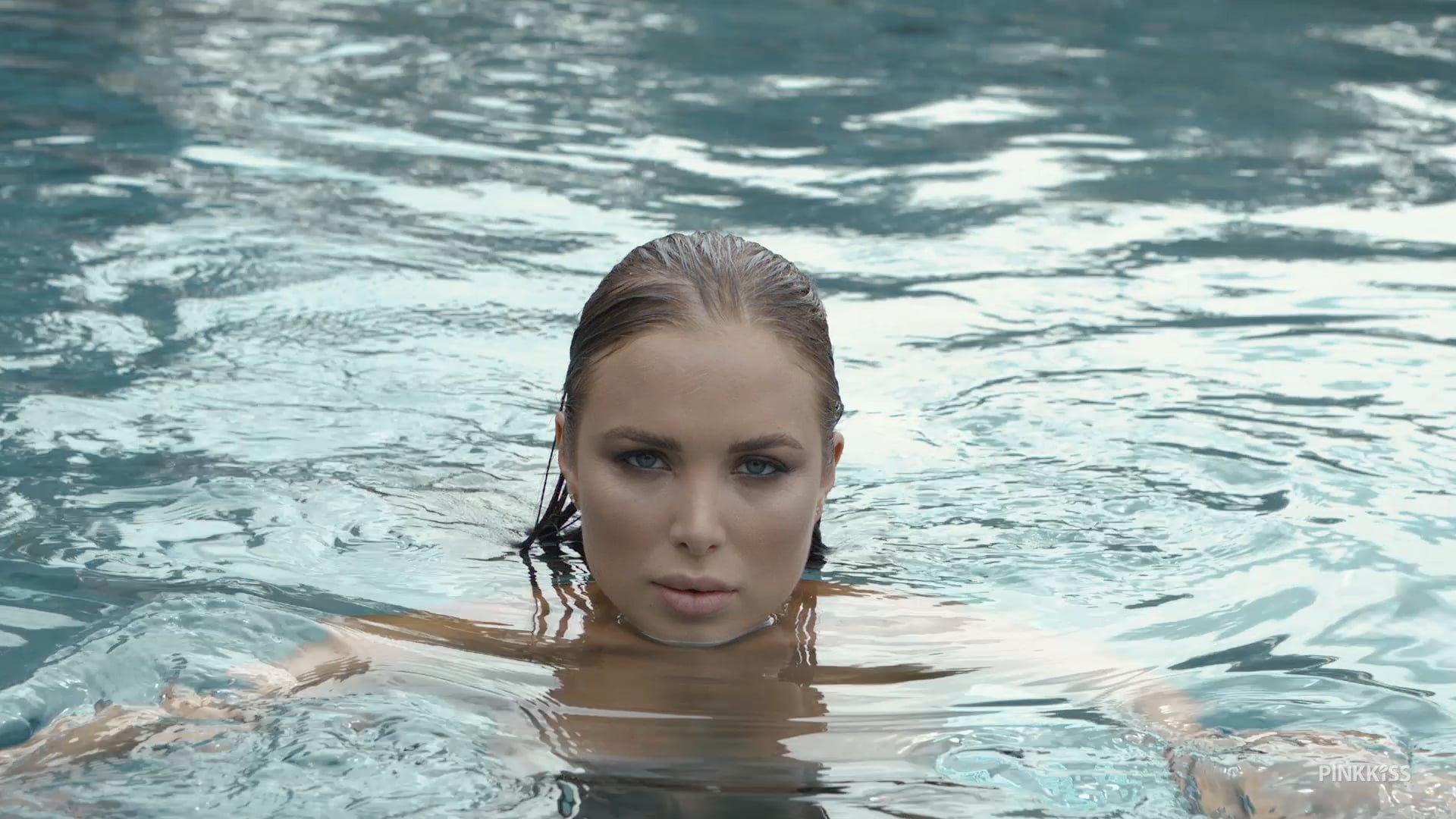 Hot girl by the pool filmed in slow motion for Pinkkiss Bali trip