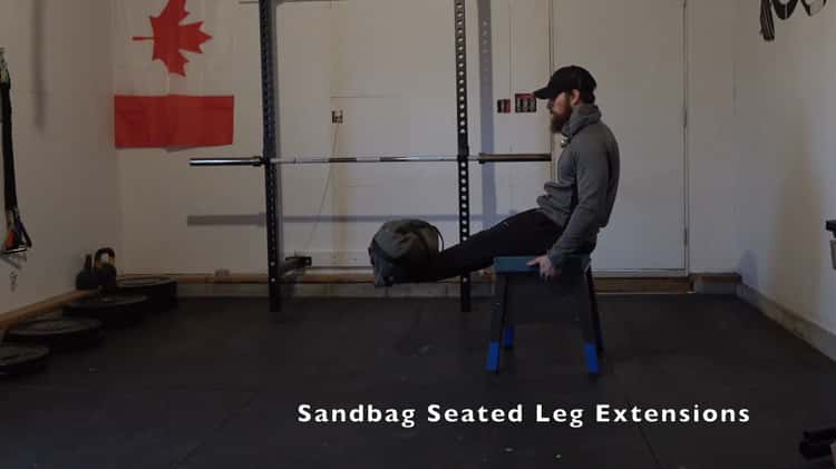 Sandbag Seated Leg Extensions on Vimeo