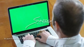 1846 young professional types on laptop green screen