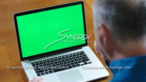 1847 negative reaction shakes head no to laptop green screen