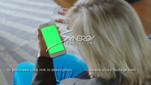 1869 woman swipes up iphone smartphone green screen
