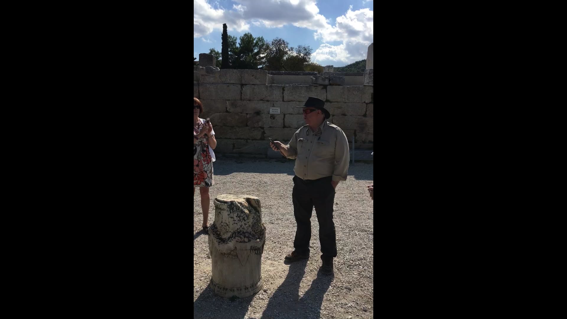 Dr. House speaking in front of the Bema in Corinth (Acts 18:12)