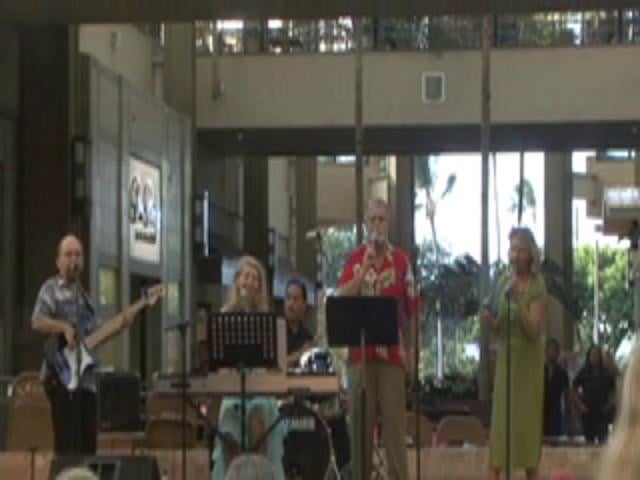 Jason Schwartz sings with friends at celebration of the Season of Peace and Non Violence