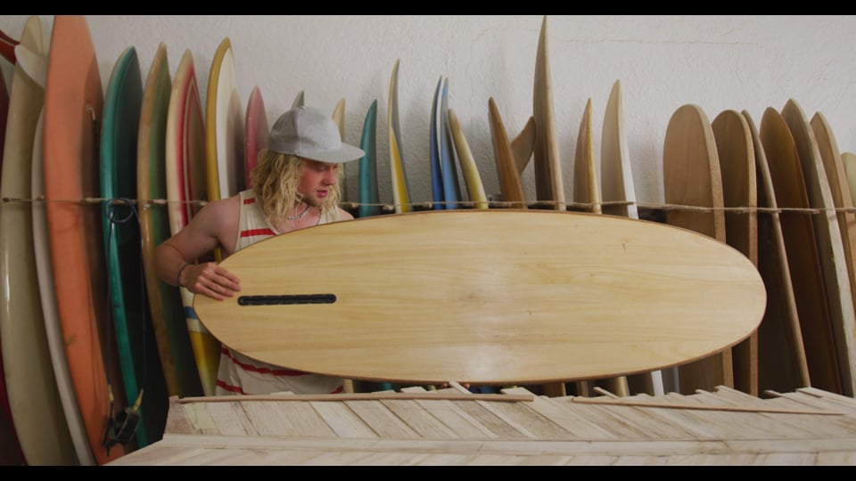 Caucasian male surfboard maker checking one of the surfboards in his studio Video from Pikwizard