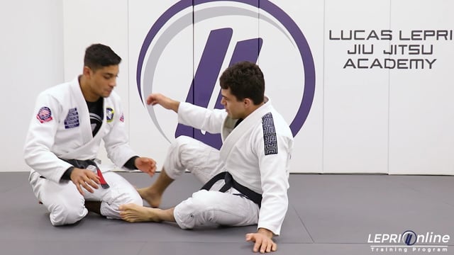 Half Guard to Guard Recomposition Using a Butterfly Hook