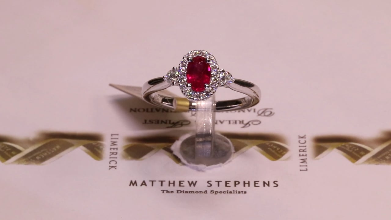 66119 - Ruby & Diamond Halo Three Stone Ring, R0.62ct & D0.26ct, Set in 18ct White Gold