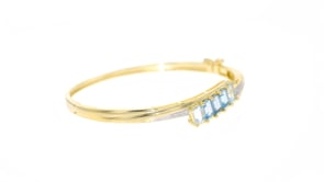 3.10 ct. t.w. Tonal Blue Topaz Bangle Bracelet with Diamond Accents in 18kt Gold Over Sterling