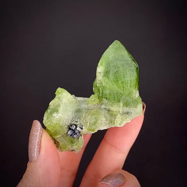 Forsterite var. Peridot with Magnetite