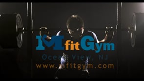 MFit Gym logo with man lifting weights in the background