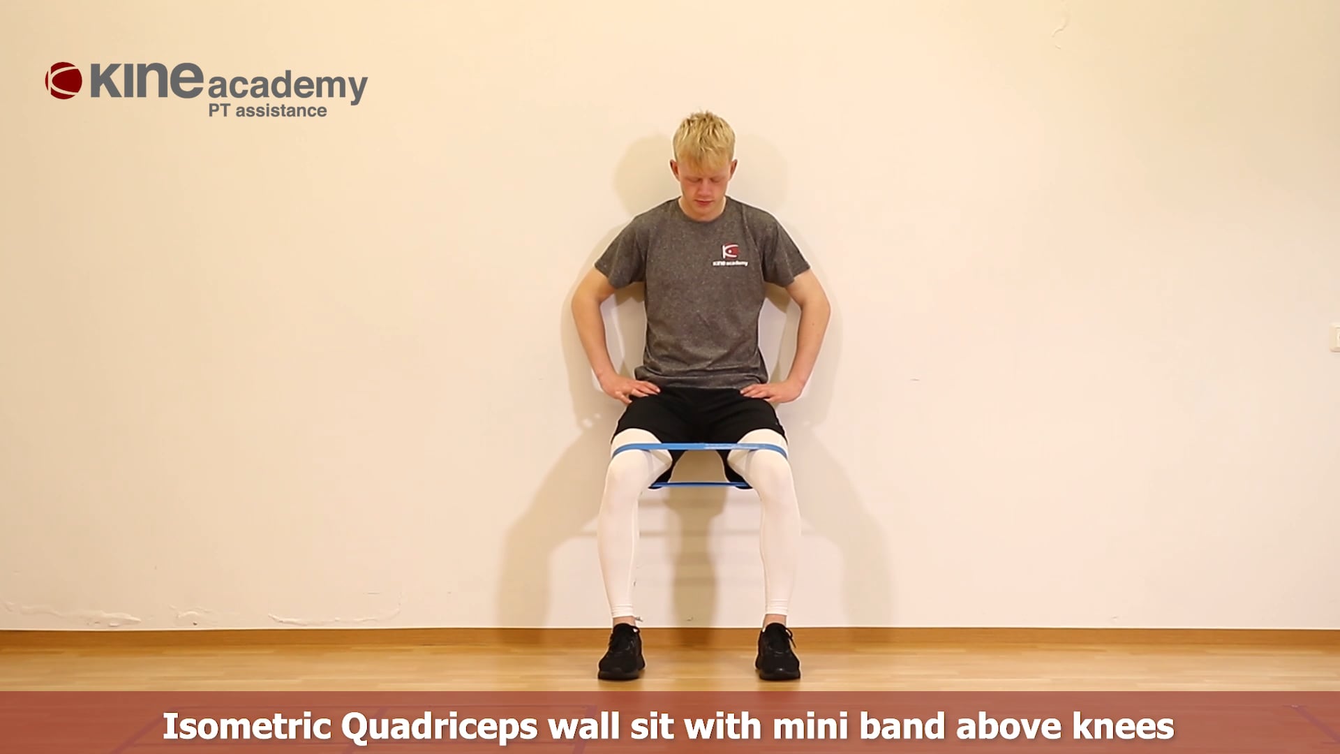 Isometric Quadriceps wall sit squat with mini band above knees on Vimeo