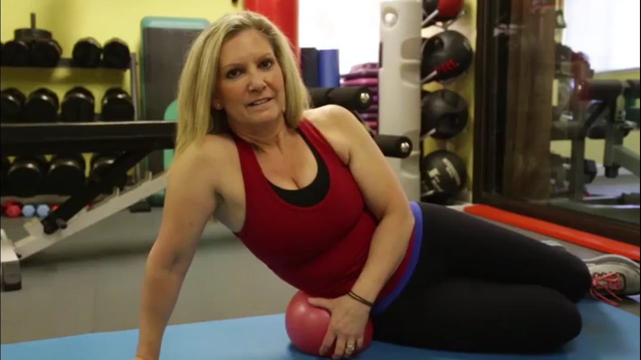 Fitness near me-Pilate ball side lying traction