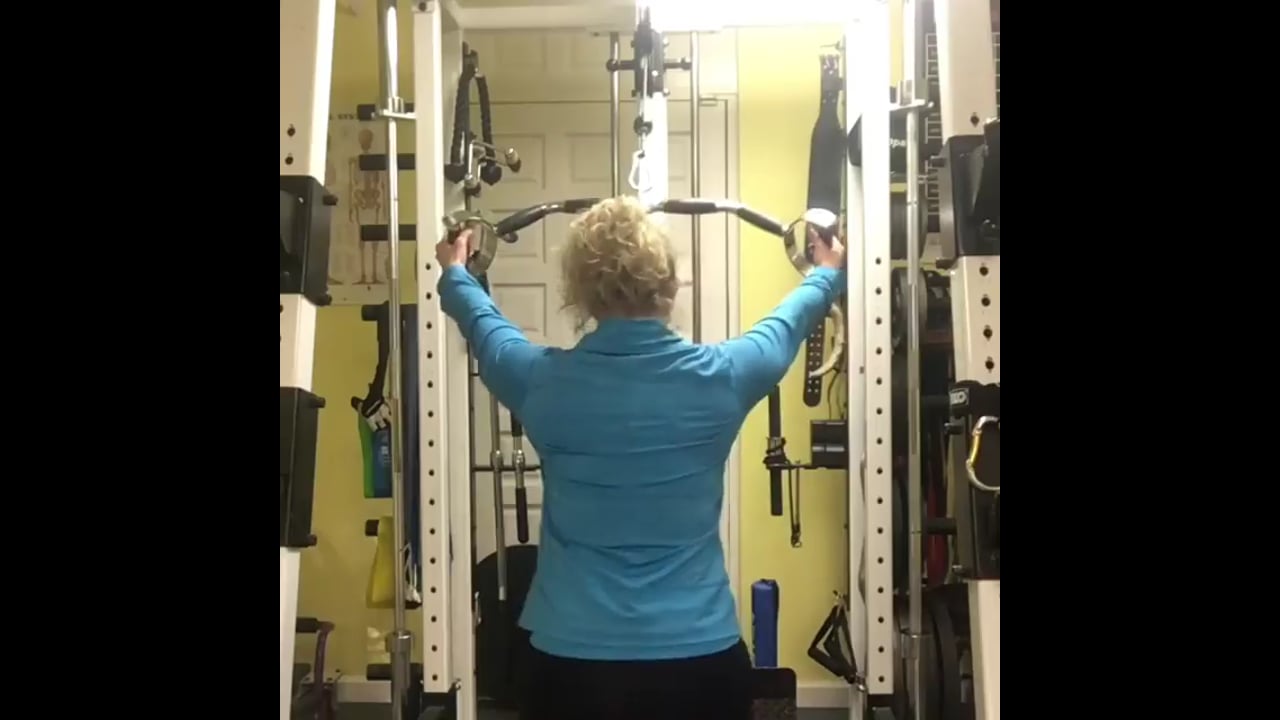Strength coach-Straight arm lat pulldown wide grip